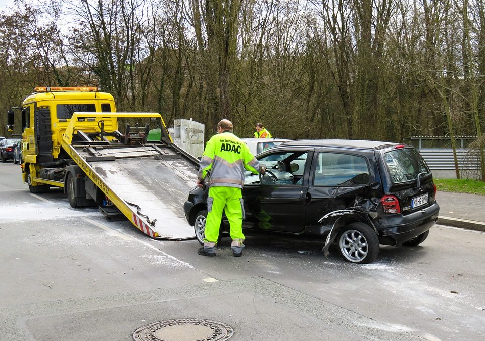 Car on a roll back truck